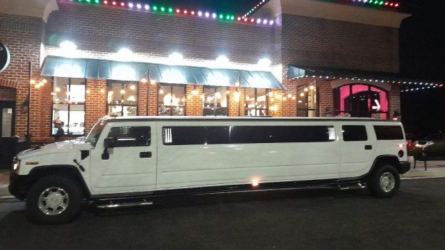 Luxury Limousine - Limousine Parked in Front of Ice Cream Shop