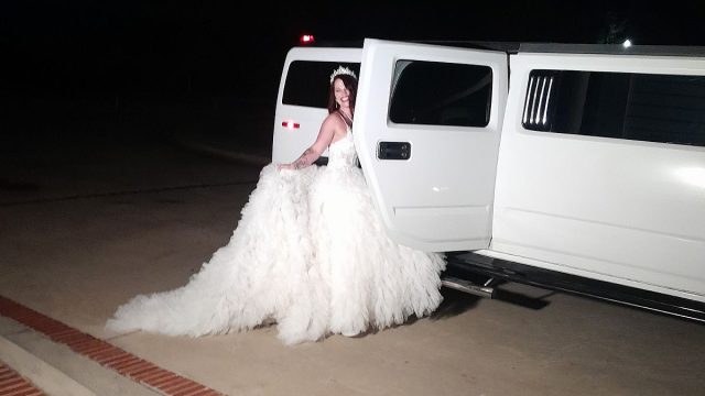 Luxury Limousine - Bride Entering a Limo at a Wedding